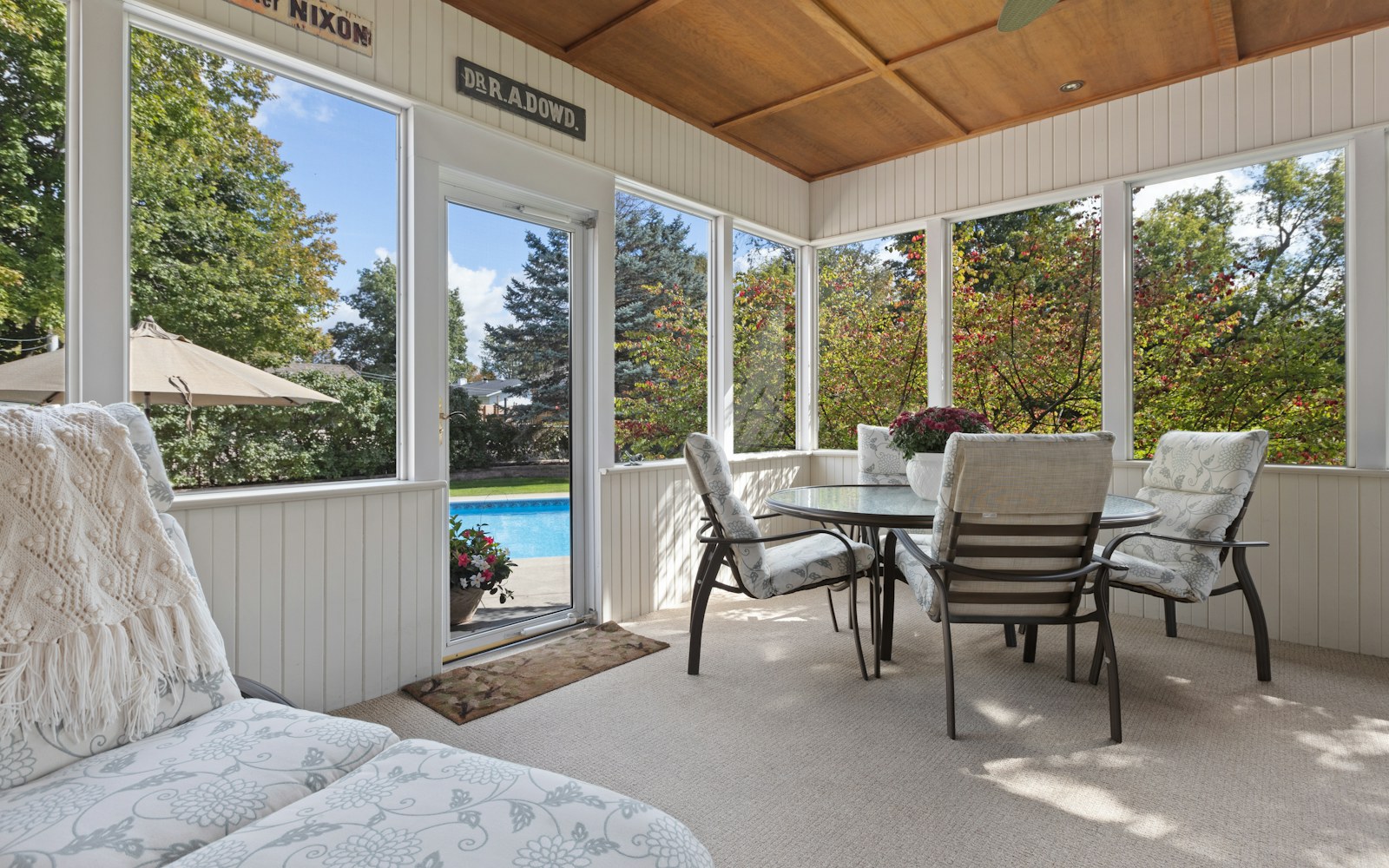 Covered patio converted into an enclosed sunroom space