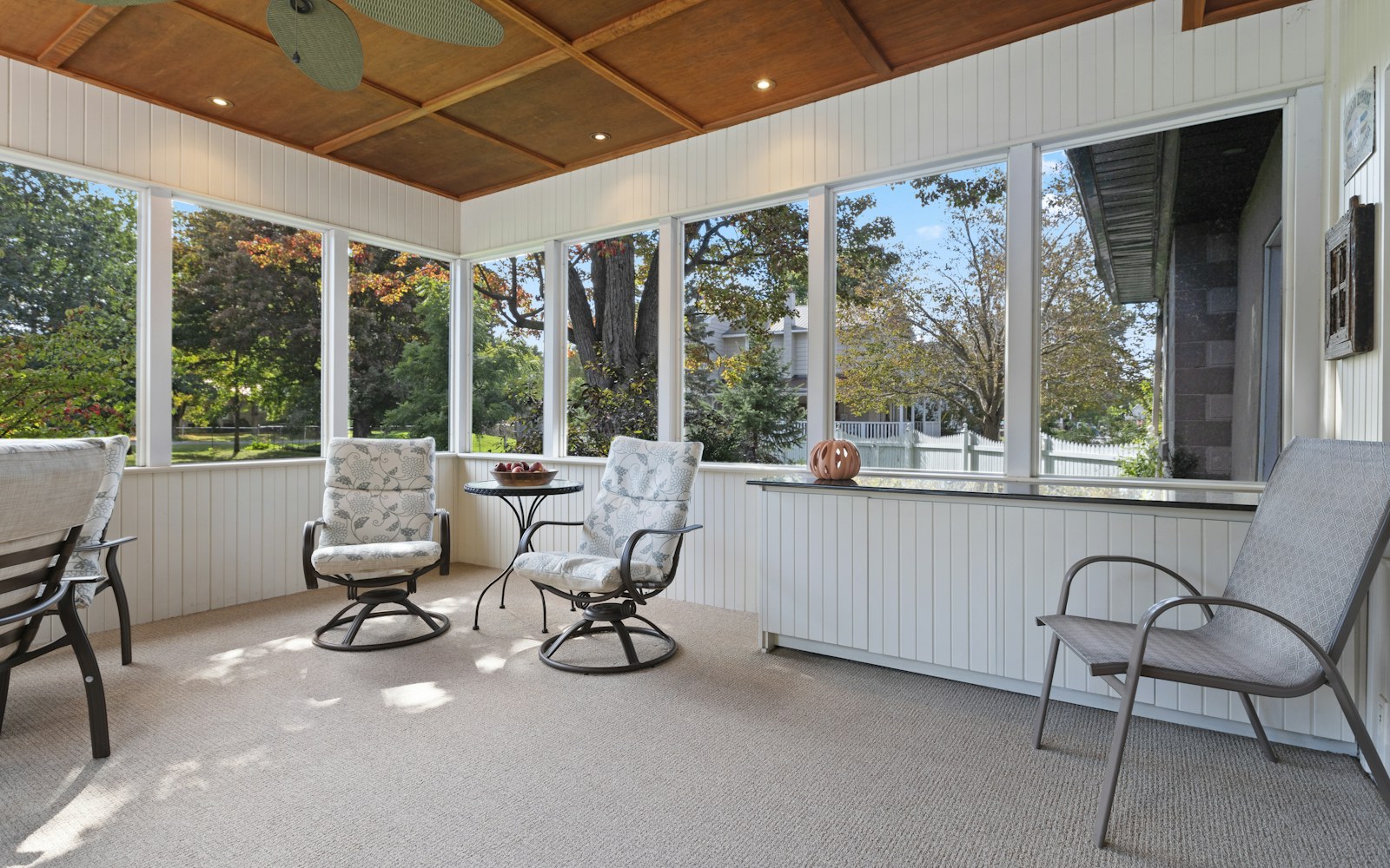 Screened porch sunroom with comfortable seating